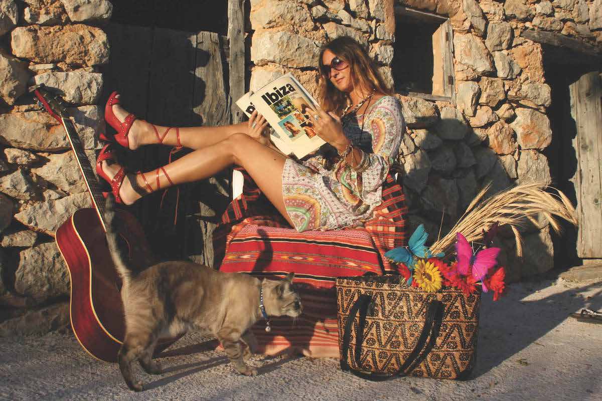 Cecilia Rossini reading in Ibiza wearing an original Hippy Chick design